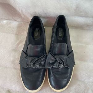 Michael Kors villa leather Black slip on sneakers with a bow accent SZ 6.5M